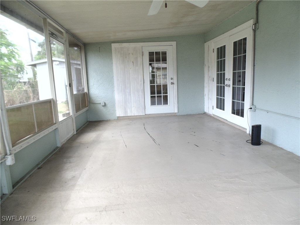18215 Iris Road Fort Myers, FL 33967 - Photo 25 of 34 an empty room with windows