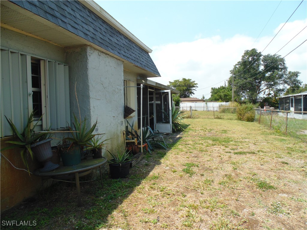 18215 Iris Road Fort Myers, FL 33967 - Photo 34 of 34 a view of a backyard with plants and lake view