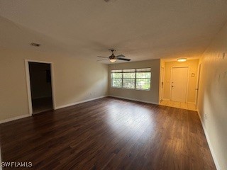 18215 Iris Road Fort Myers, FL 33967 - Photo 8 of 34 an empty room with wooden floor and windows
