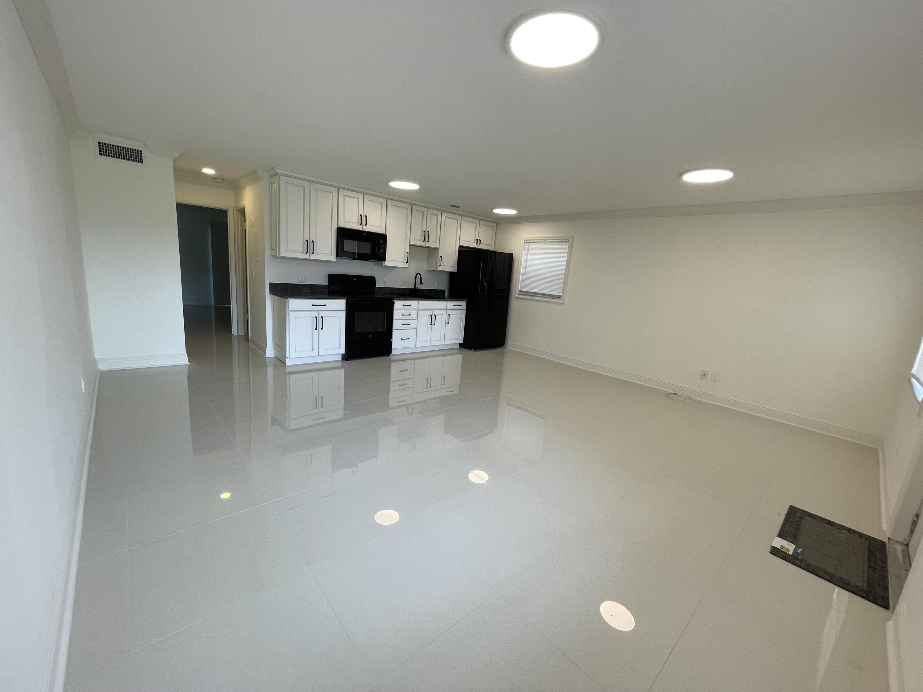 1225 Northwest 21st Street Northwest, Unit 151505 Stuart, FL 34994 - Photo 1 of 44 Open Living Dining Kitchen