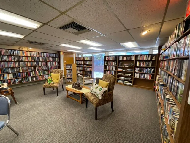 a reading room with furniture and gym equipment
