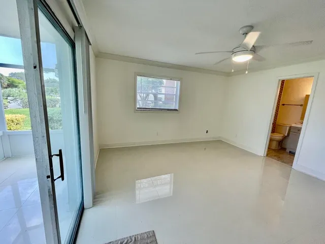a view of a big room with closet and wooden floor