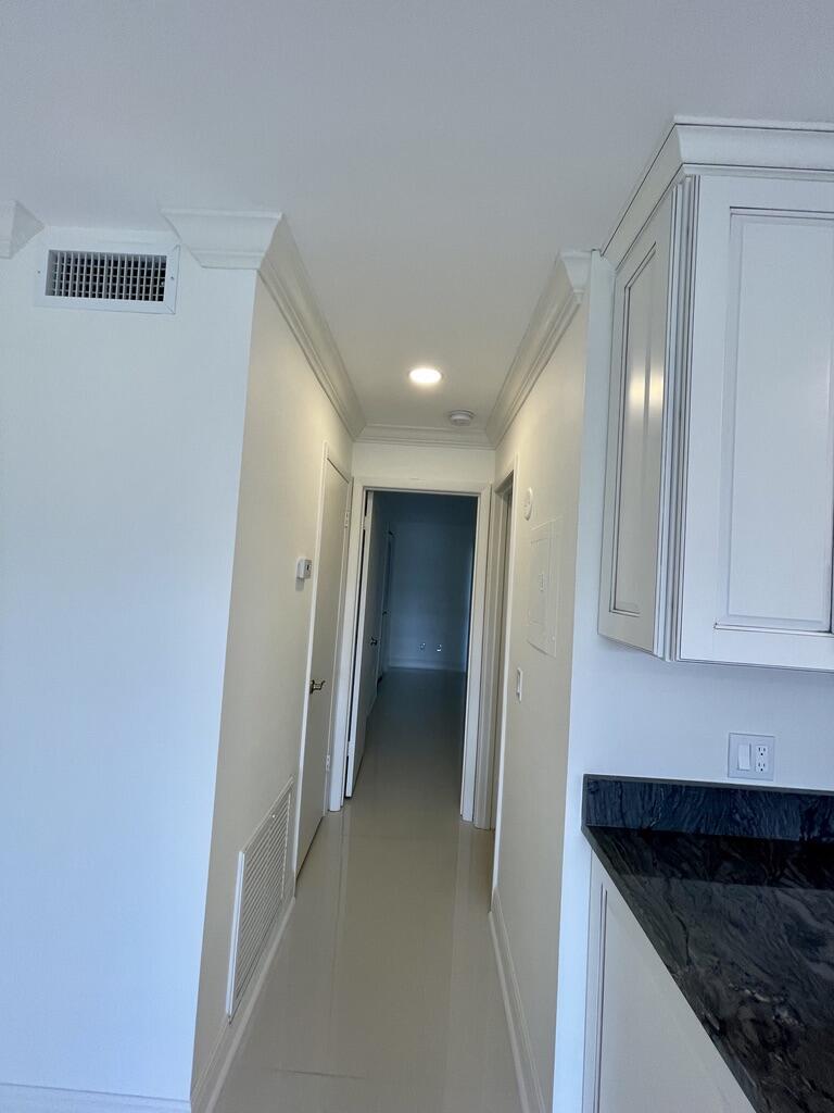 1225 Northwest 21st Street Northwest, Unit 151505 Stuart, FL 34994 - Photo 36 of 44 Hallway- Crown Molding