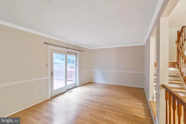 a view of a livingroom with wooden floor