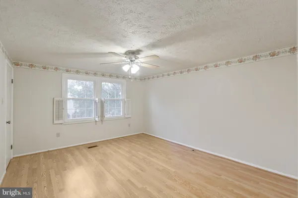 a view of empty room with windows