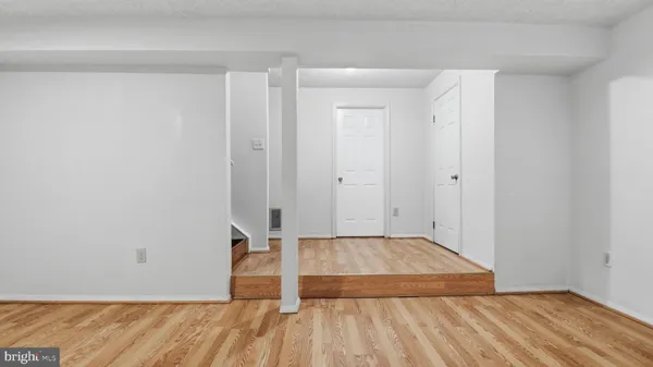 a room with a washing machine and a sink