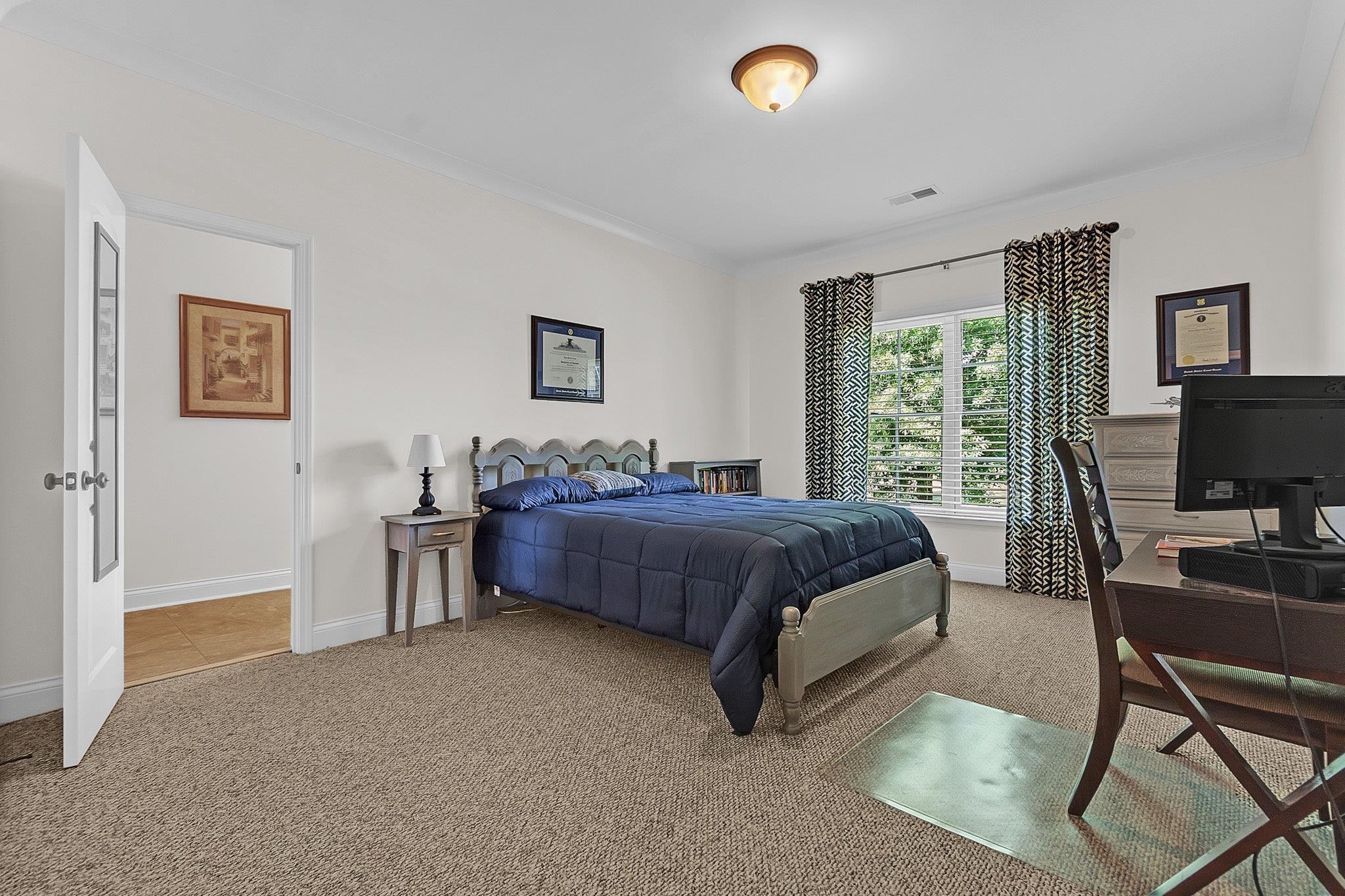 3246 North Hartwell Ridge Drive Collierville, TN 38017 - Photo 31 of 40 Carpeted room featuring a double window with blinds, ceiling-mounted light fixture, and crown molding