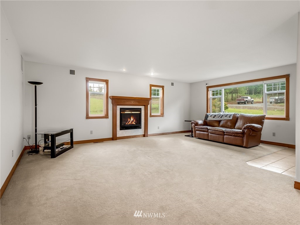 534 Tennessee Road Winlock, WA 98596 - Photo 5 of 40 a living room with furniture and a fireplace