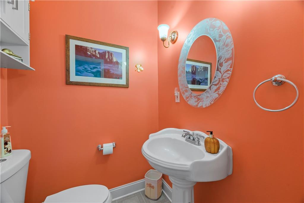747 Achortown Road Beaver Falls, PA 15010 - Photo 12 of 28 a bathroom with a toilet sink and mirror