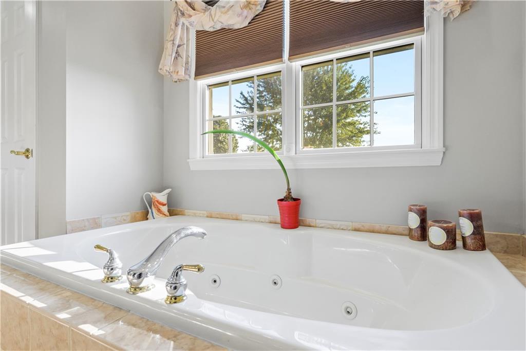 747 Achortown Road Beaver Falls, PA 15010 - Photo 16 of 28 a bathroom with a tub and a window