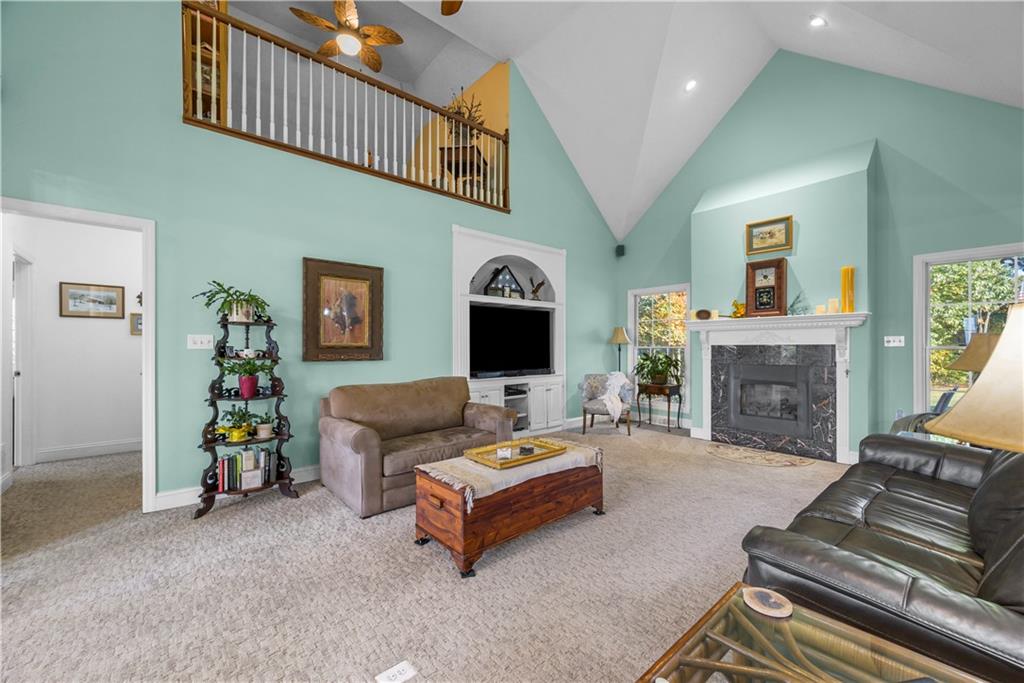 747 Achortown Road Beaver Falls, PA 15010 - Photo 5 of 28 a living room with furniture and a fireplace