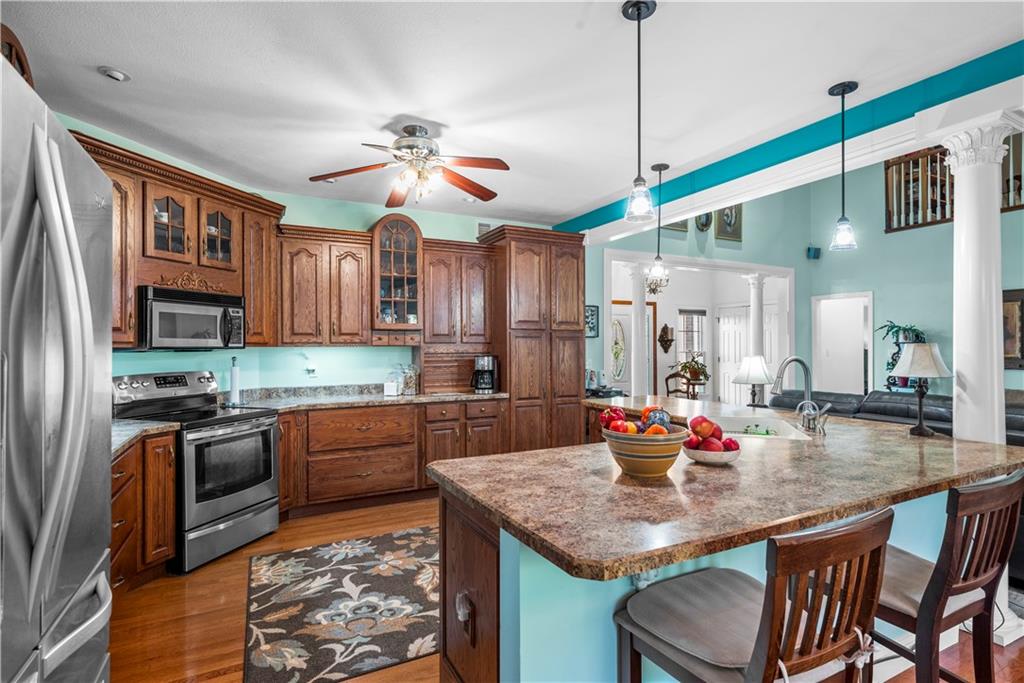 747 Achortown Road Beaver Falls, PA 15010 - Photo 10 of 28 a kitchen with stainless steel appliances granite countertop a sink a stove and refrigerator