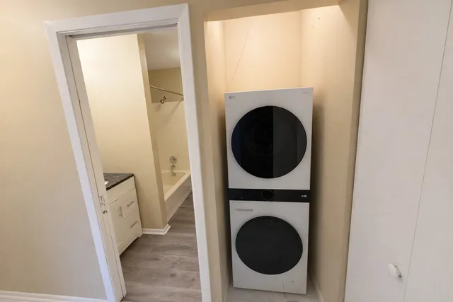 a view of a hallway with washer and dryer