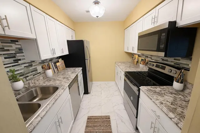 a kitchen with a stove and a microwave