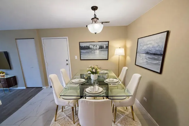 a view of a dining room with furniture and wooden floor