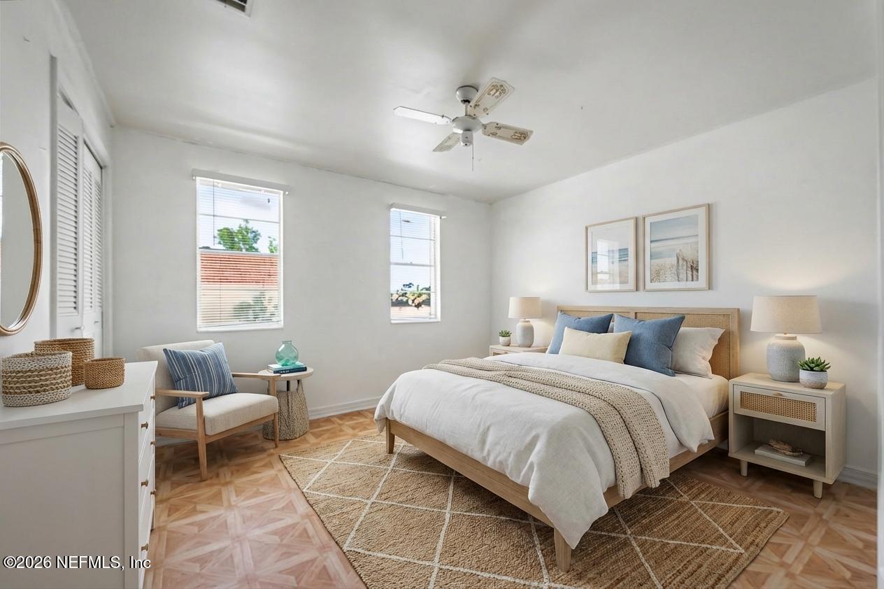 1540 El Prado Road, Unit 4 Jacksonville, FL 32216 - Photo 7 of 14 a bedroom with a bed and a chandelier