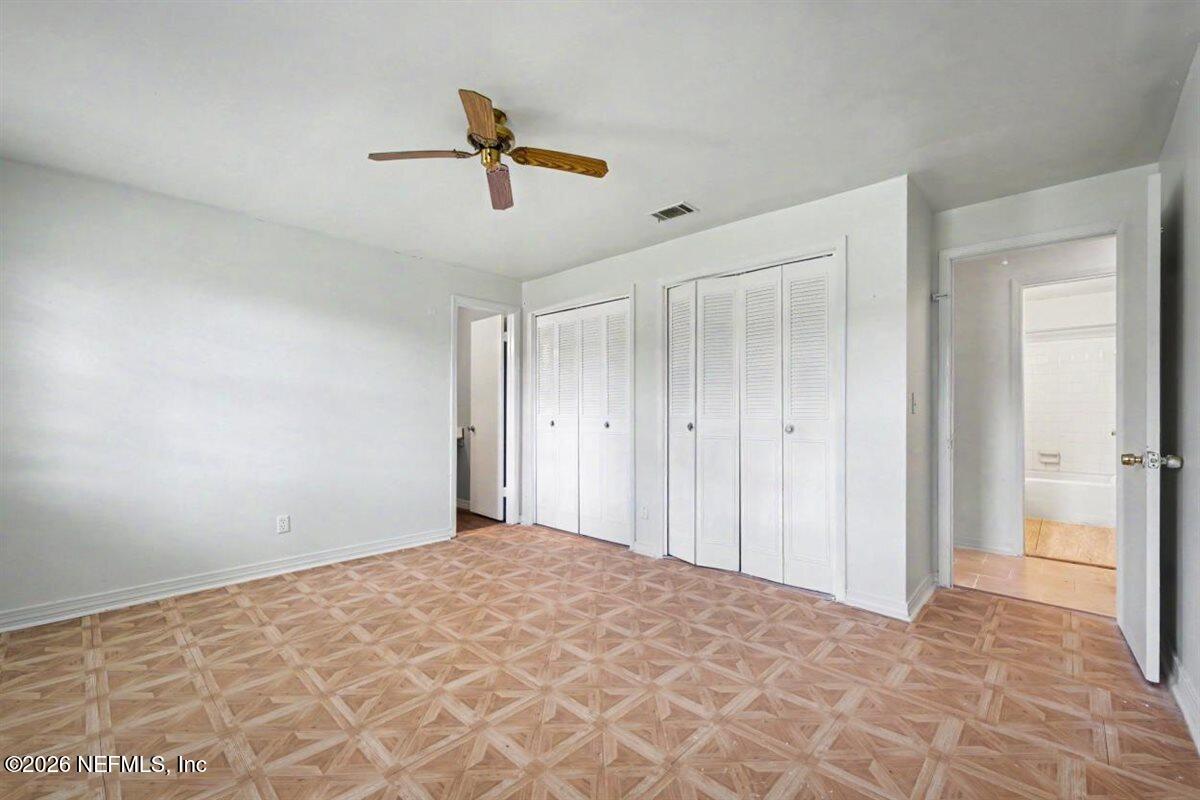 1540 El Prado Road, Unit 4 Jacksonville, FL 32216 - Photo 8 of 14 a view of a livingroom with a ceiling fan and window