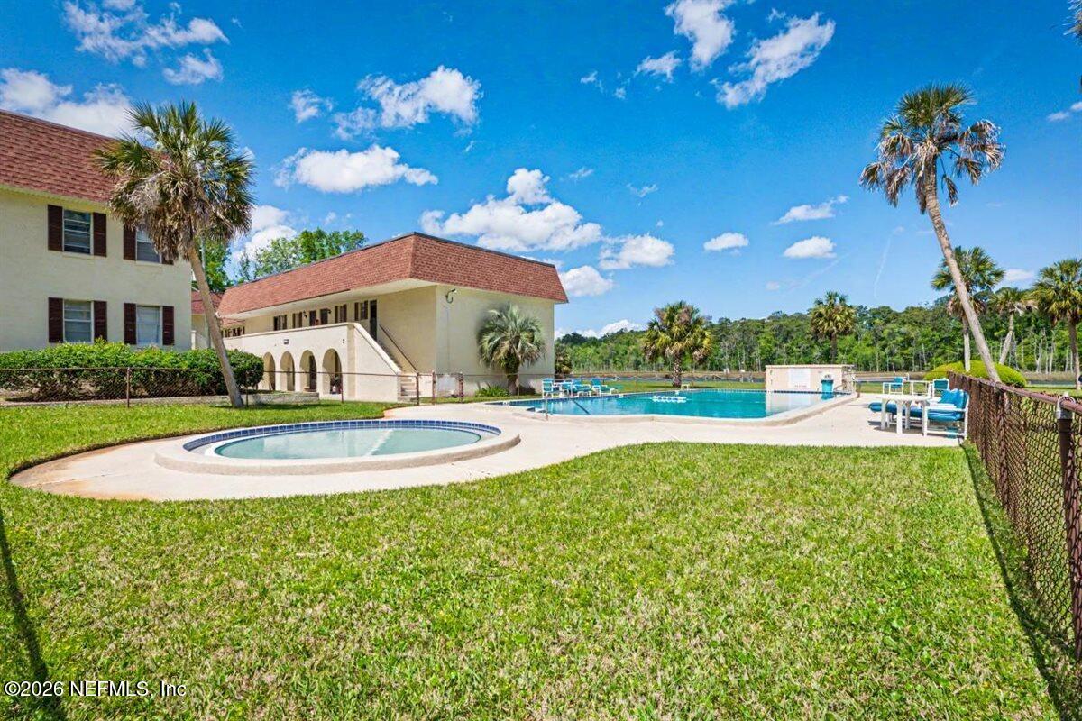 1540 El Prado Road, Unit 4 Jacksonville, FL 32216 - Photo 10 of 14 a view of a house with a yard and a fountain