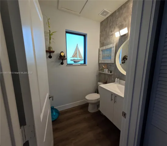 a bathroom with a toilet and a sink