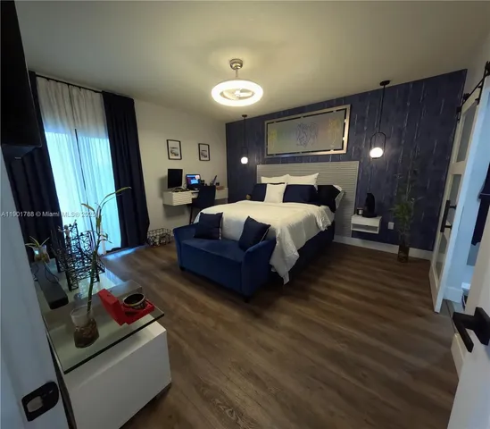 a bed room with furniture and a window