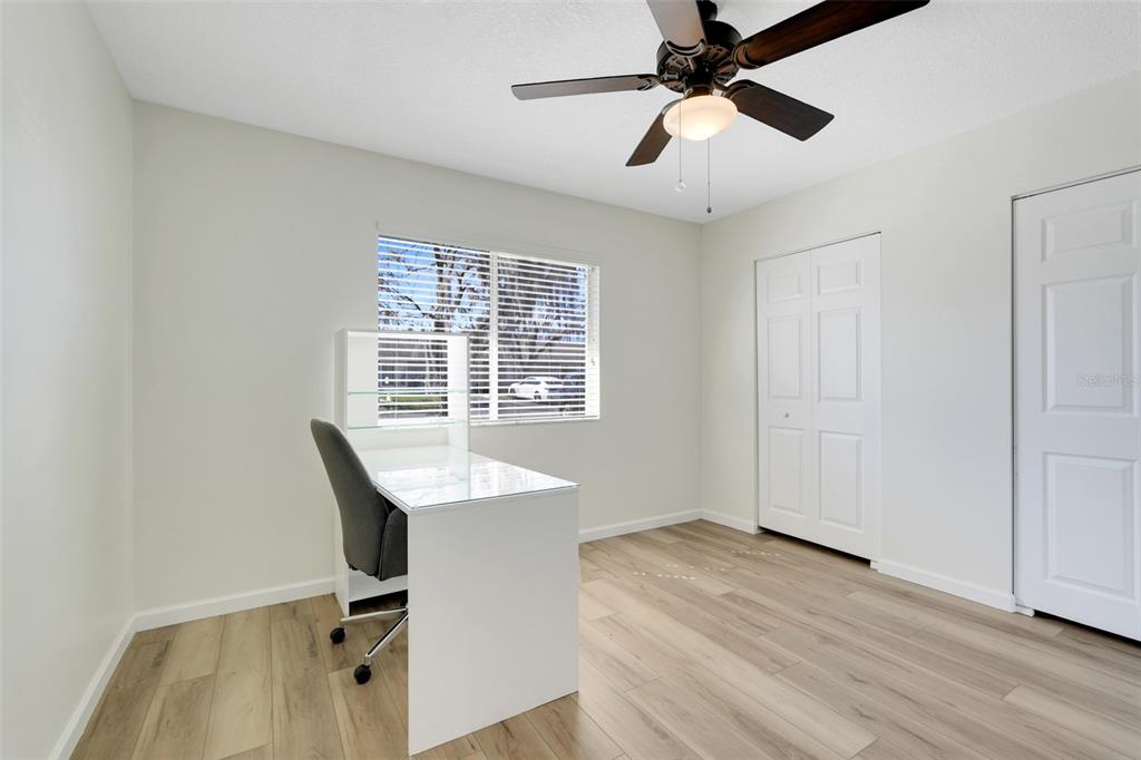 30024 Tavares Ridge Boulevard, Unit 62 Tavares, FL 32778 - Photo 21 of 31 a view of a workspace with furniture and a window