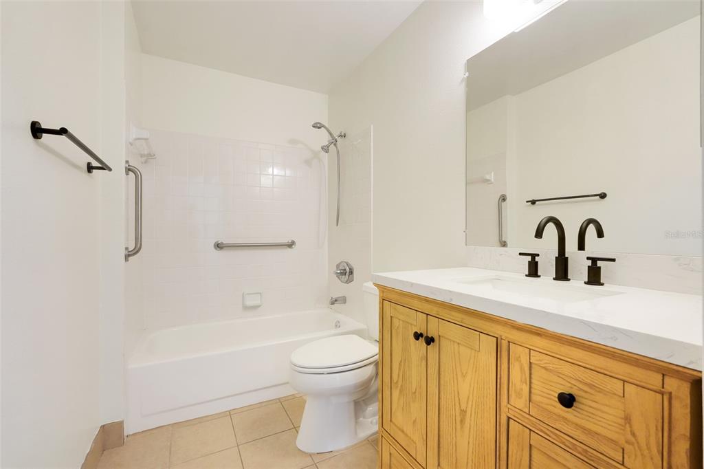 30024 Tavares Ridge Boulevard, Unit 62 Tavares, FL 32778 - Photo 22 of 31 a bathroom with a sink a toilet and a bathtub