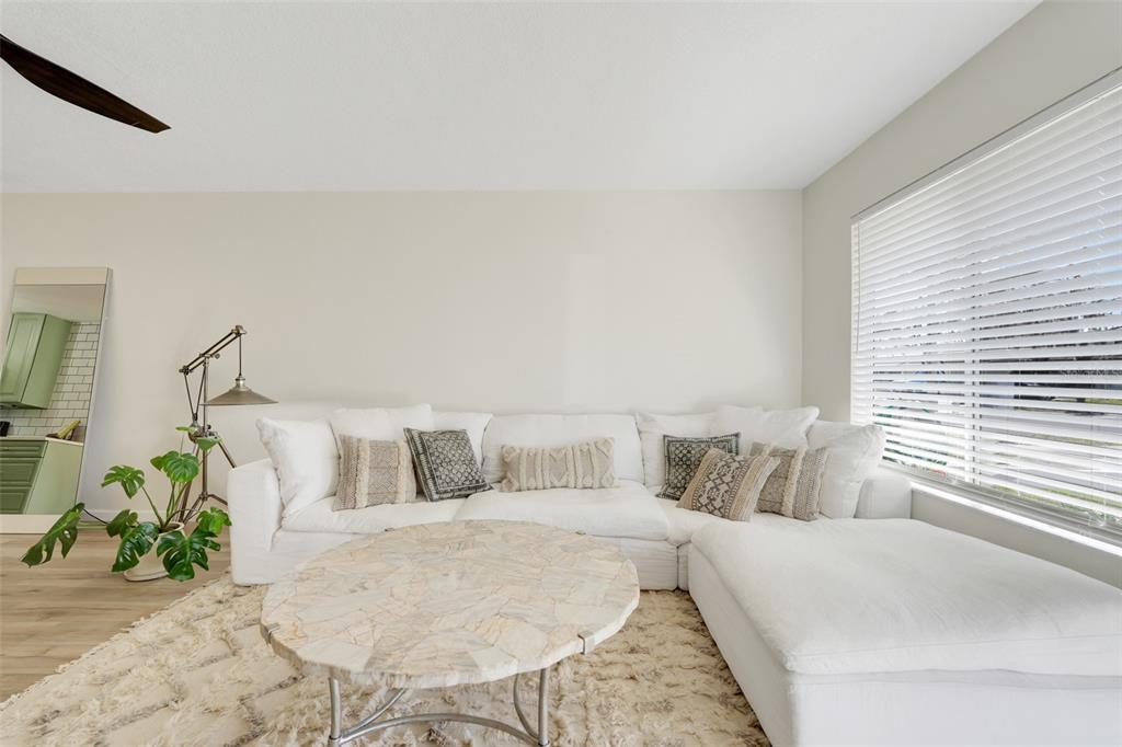 30024 Tavares Ridge Boulevard, Unit 62 Tavares, FL 32778 - Photo 6 of 31 a bedroom with a bed and a window