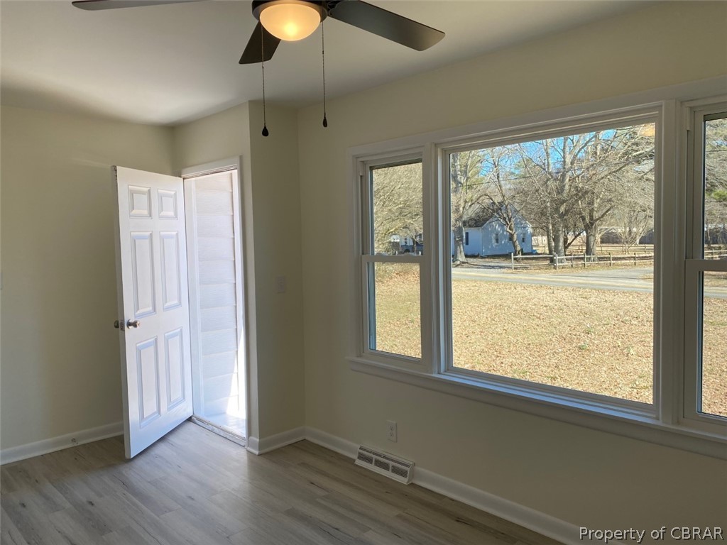 6892 Williams Landing Road Hayes, VA 23072 - Photo 5 of 25 LIVING ROOM. NEW WINDOWS THROUGHOUT/NEW PAINT/NEW VINYL-PLANK FLOORS