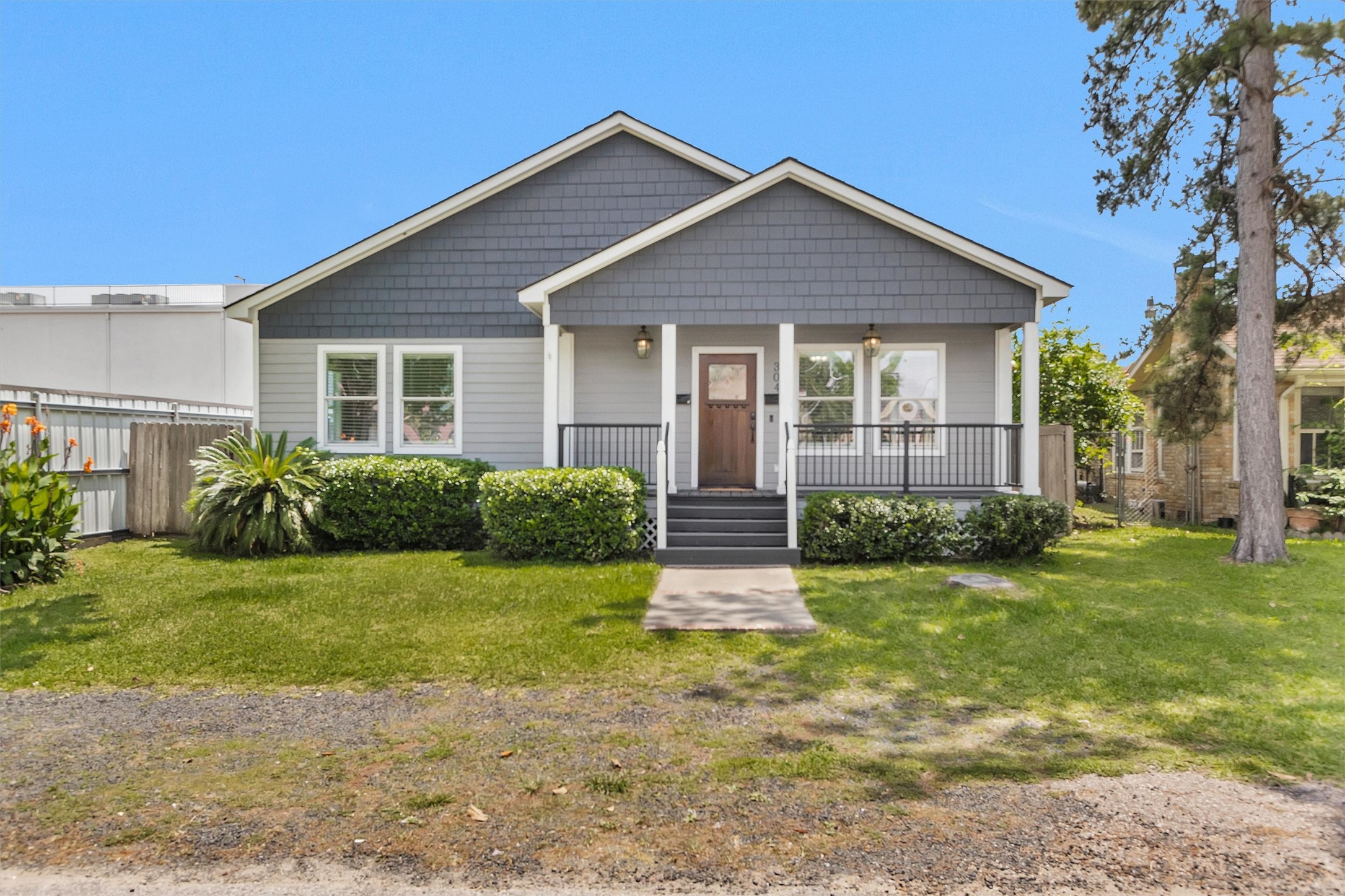 304 Vincent Street Houston, TX 77009 - Photo 1 of 36 a front view of a house with a yard
