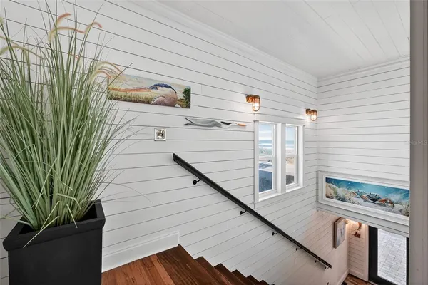 a view of a a dining room with furniture window and wooden floor