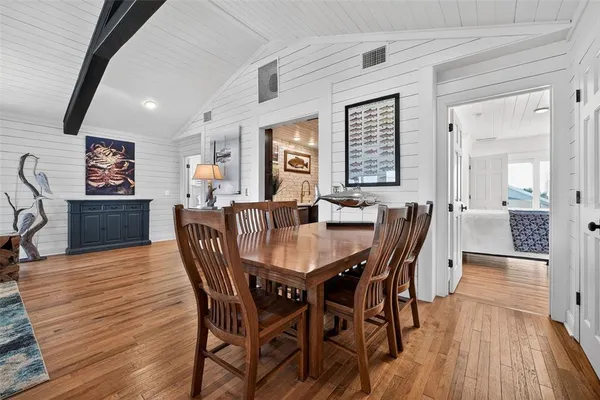 a bathroom with a shower a mirror and a sink