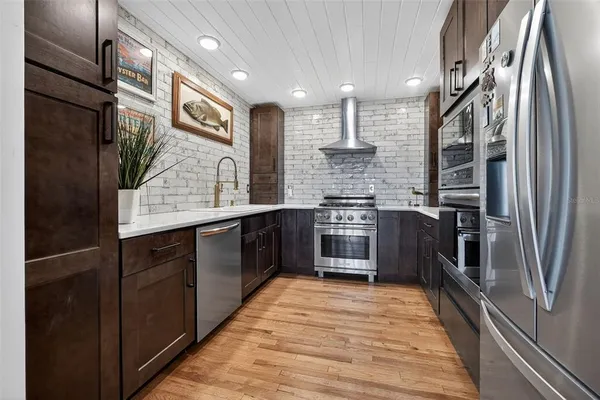 a bed room with a bed and a chandelier