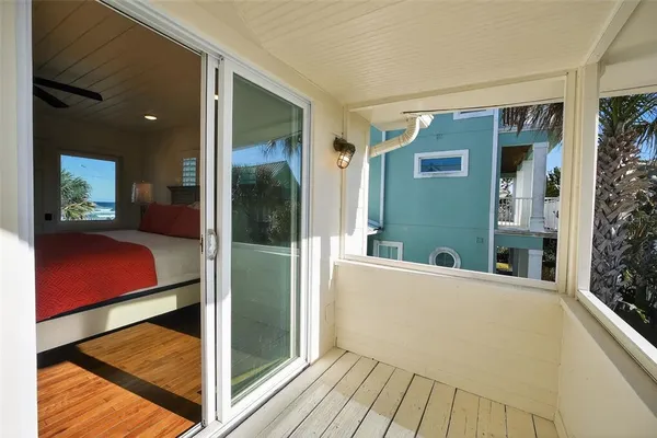 a spacious bedroom with a bed and a shower