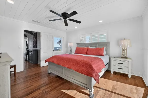 a bedroom with bed and window