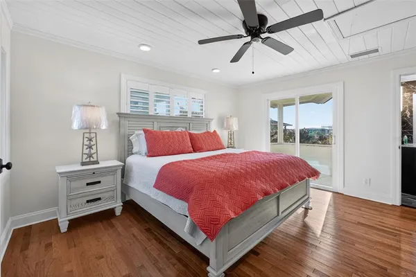 a bedroom with bed and window