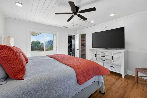 a bedroom with a bed and a dresser