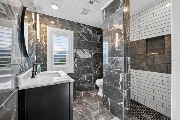 an empty room with a empty space and windows