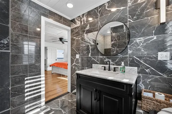 an empty room with windows and white walls