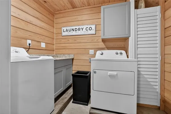 a bed room with furniture and gym equipment