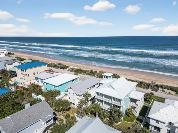 an aerial view of a house with swimming pool