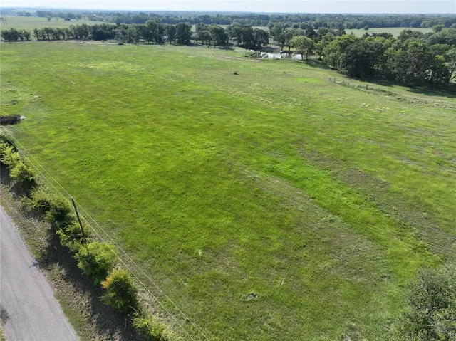 a view of a field with an outdoor space