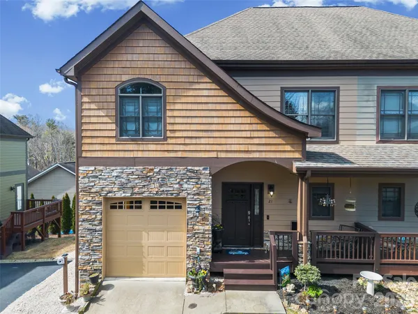 a front view of a house with a garage