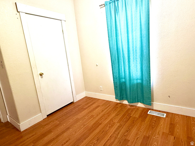 1025 North 300 West, Unit 1 Springville, UT 84663 - Photo 18 of 35 Unfurnished bedroom featuring wood finished floors and baseboards