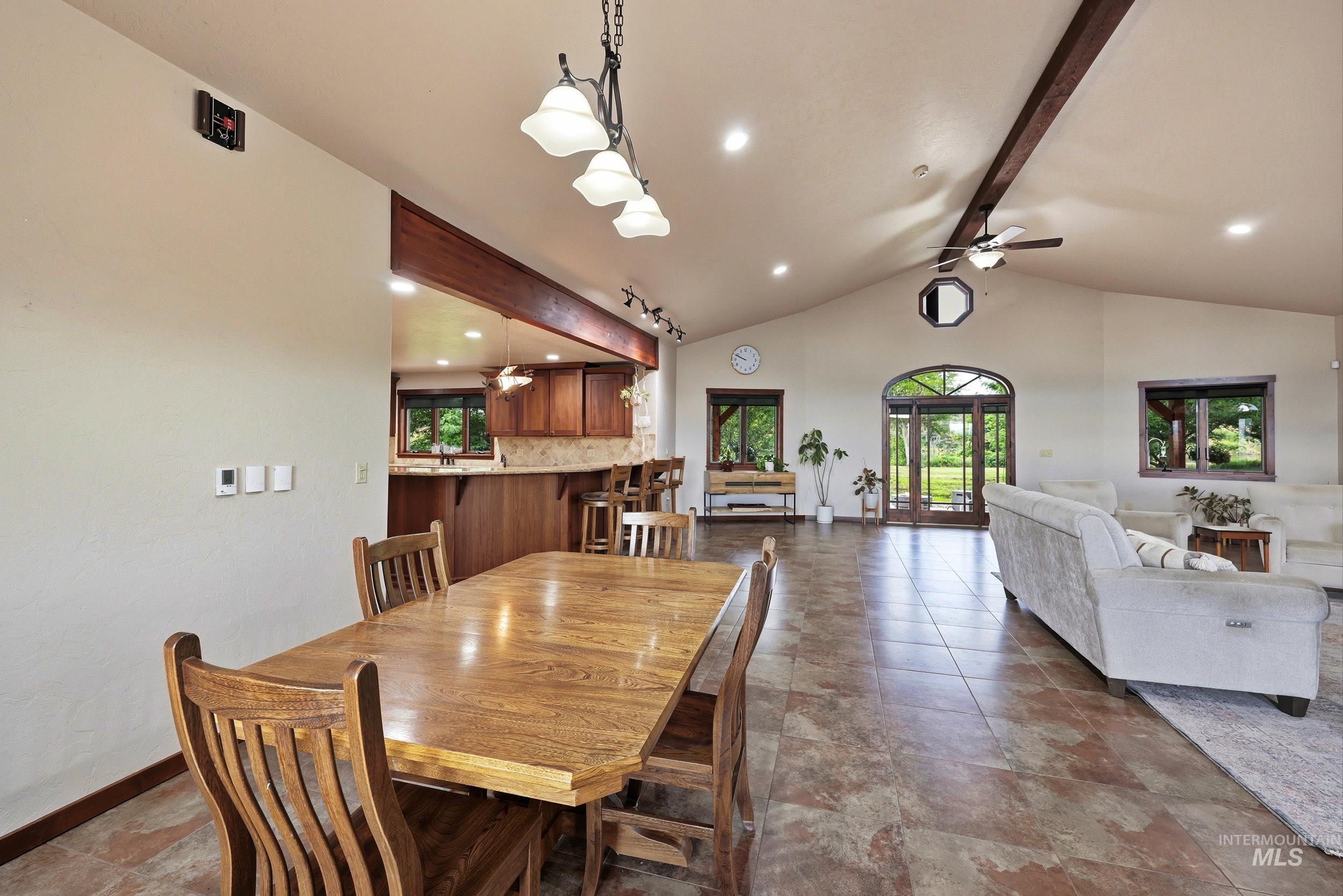 339 Airport Road Weiser, ID 83672 - Photo 10 of 49 Open concept living area with vaulted ceilings and exposed wood beams