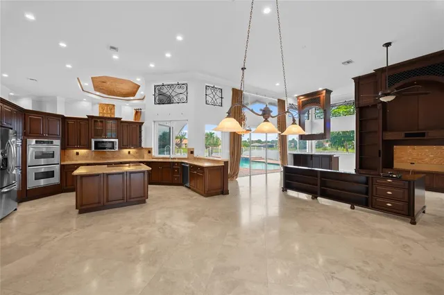 a kitchen with stainless steel appliances granite countertop a stove and cabinets
