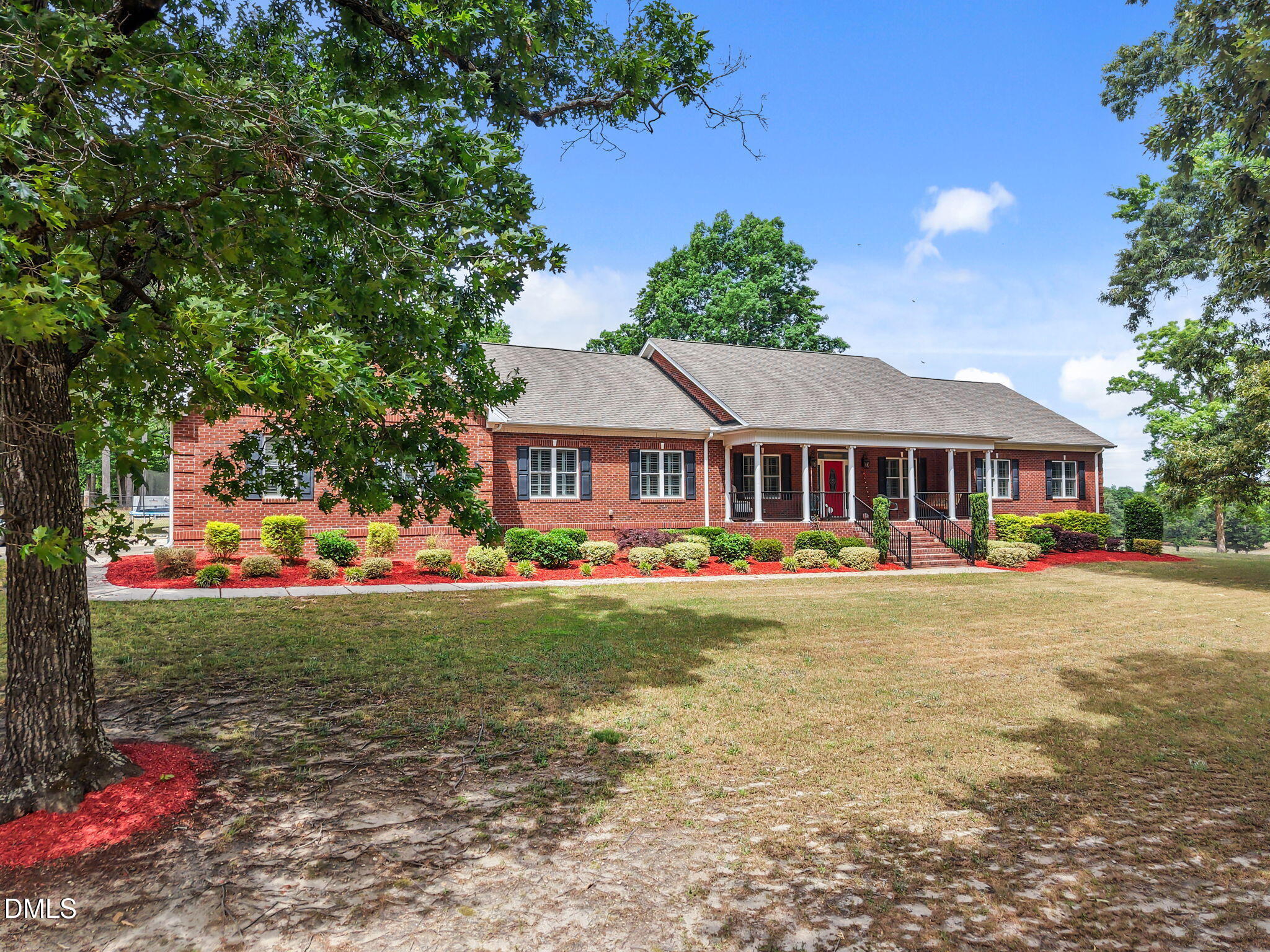 2880 Elevation Road Four Oaks, NC 27524 - Photo 2 of 51 a front view of house with outdoor space and garden