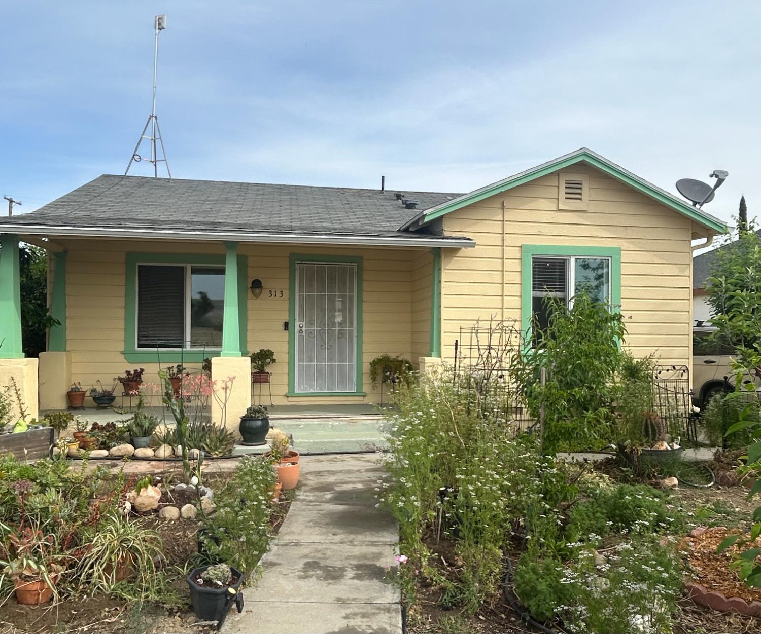 a front view of house with yard outdoor seating