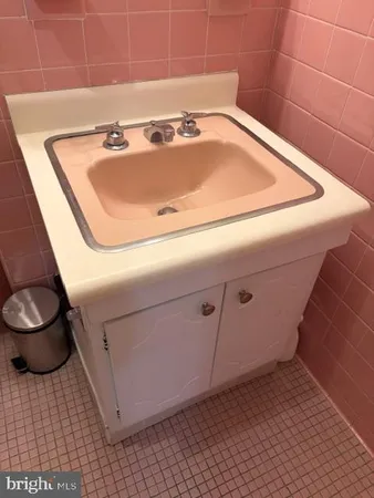 a bathroom with a sink and toilet