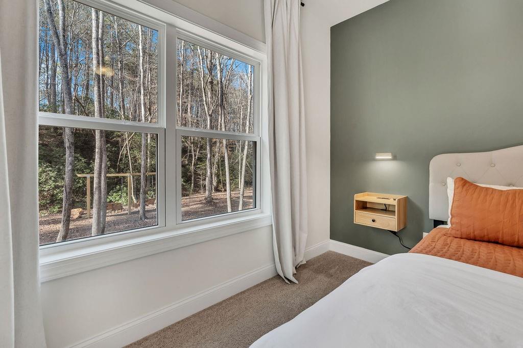 246 Woodward Way Talking Rock, GA 30175 - Photo 18 of 39 a bedroom with a bed and a large window