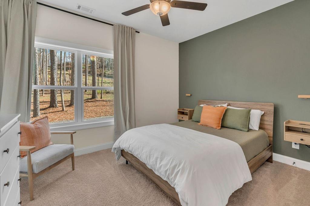 246 Woodward Way Talking Rock, GA 30175 - Photo 23 of 39 a bedroom with a bed and a couch
